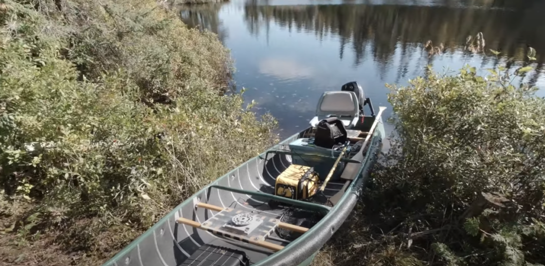 Wide canoe by the water's edge